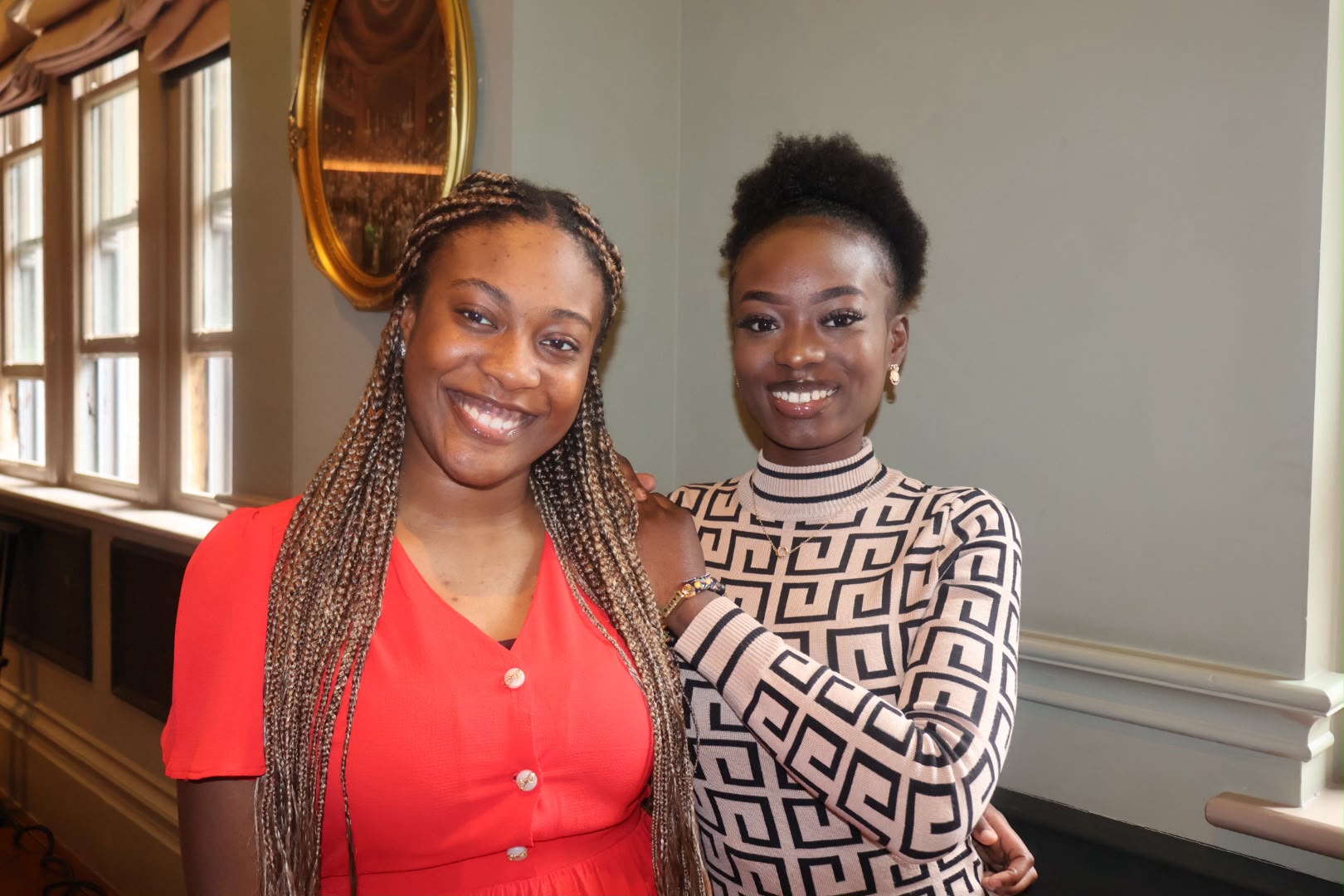Two women smiling together